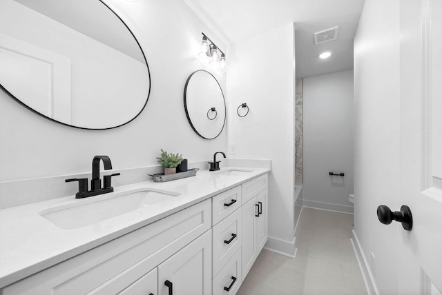 full bathroom with vanity, washtub / shower combination, and toilet