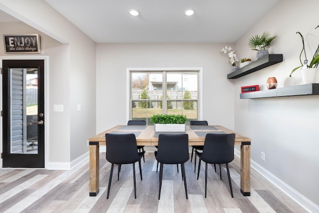 dining space featuring light wood-type flooring