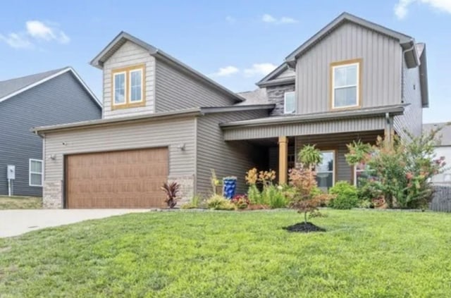 view of front facade featuring a garage and a front lawn