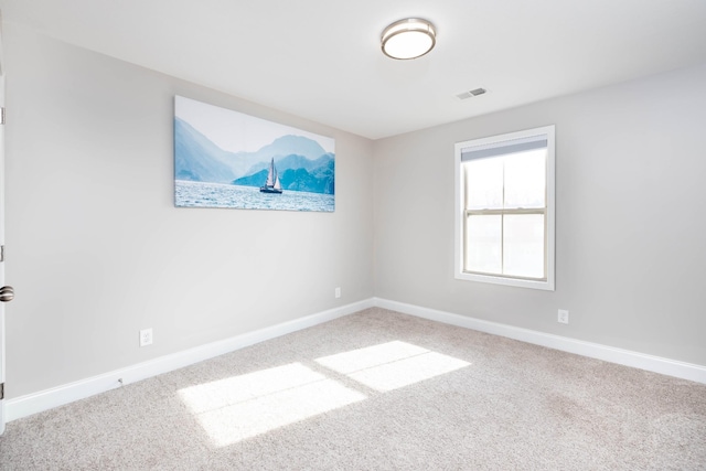 unfurnished room featuring carpet