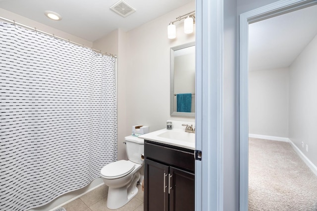 bathroom with tile patterned flooring, vanity, a shower with curtain, and toilet