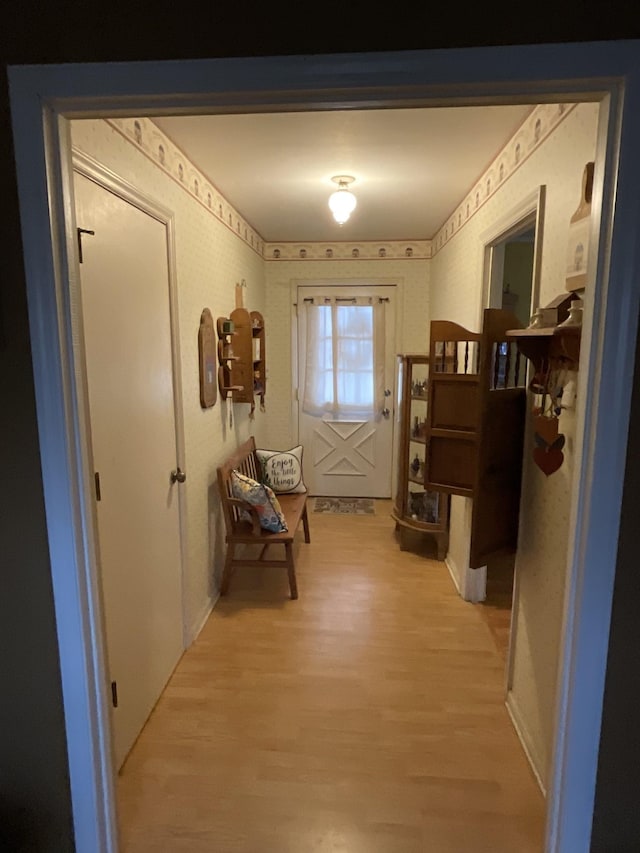 doorway with light hardwood / wood-style floors