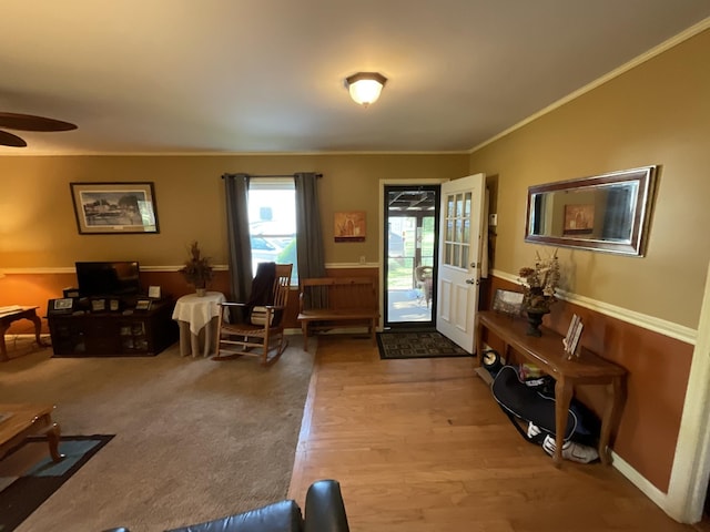 entryway featuring crown molding, ceiling fan, and light hardwood / wood-style flooring