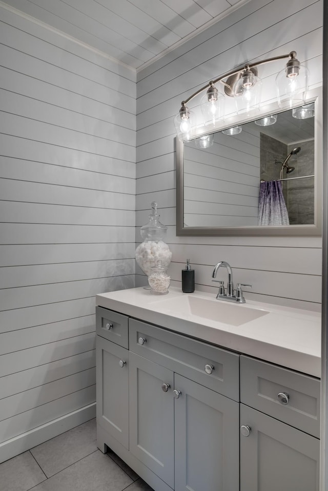 bathroom with tile patterned floors, curtained shower, and vanity