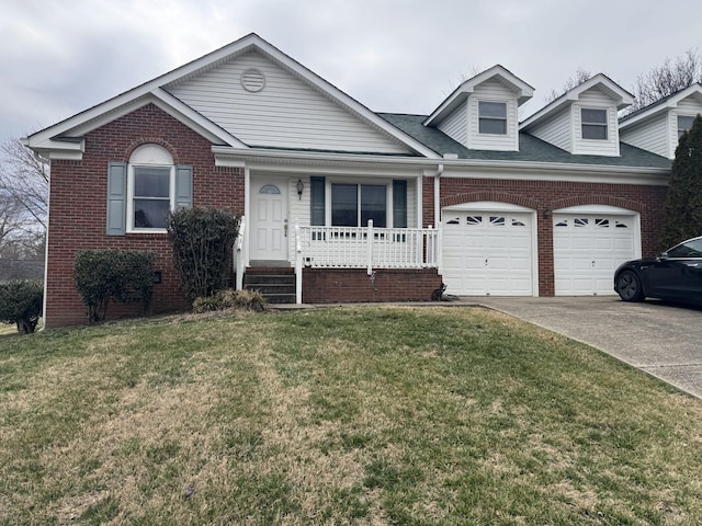 view of front of house with a garage, a front lawn, and covered porch