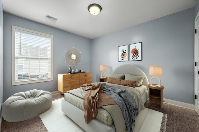 bedroom featuring light carpet