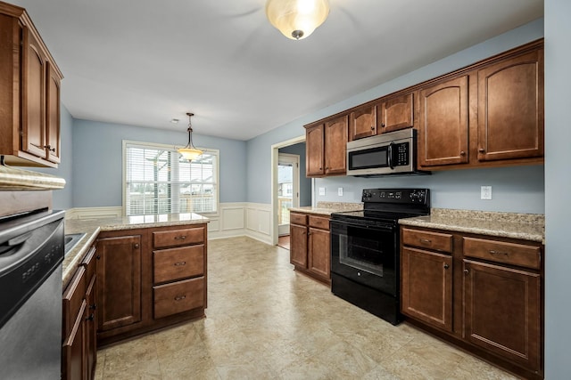 kitchen featuring appliances with stainless steel finishes and hanging light fixtures