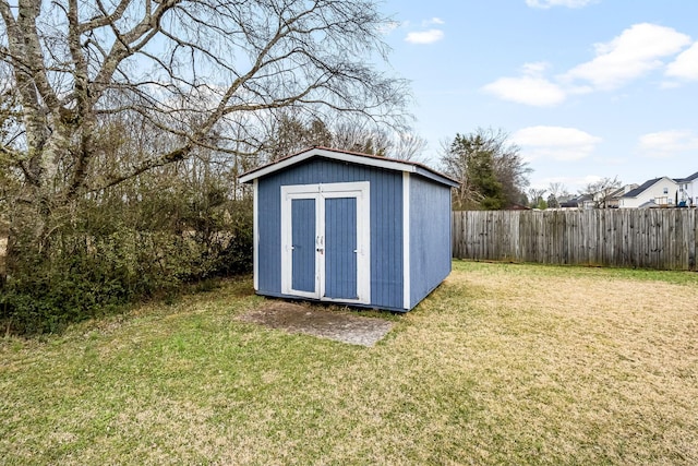 view of outdoor structure with a lawn