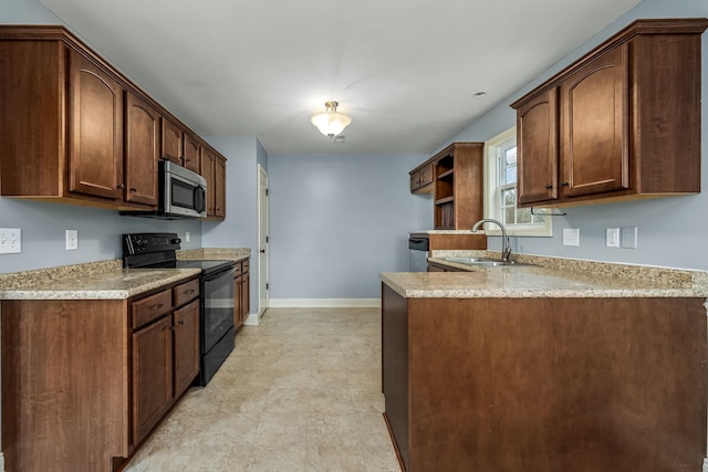 kitchen featuring black range with electric stovetop, light stone countertops, sink, and kitchen peninsula