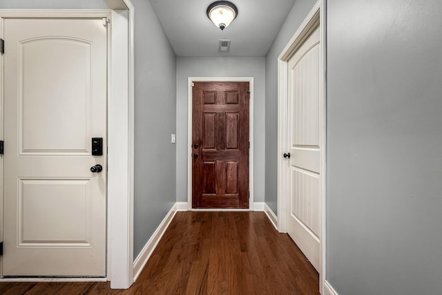 doorway to outside featuring dark hardwood / wood-style flooring