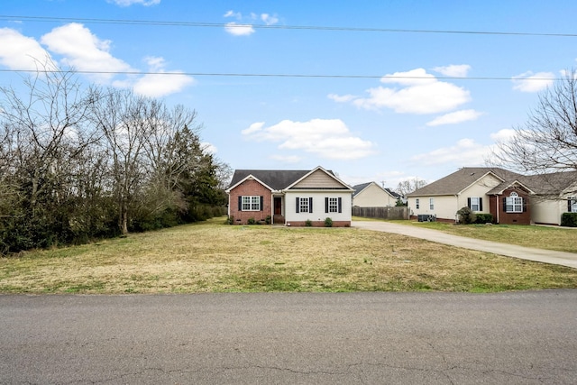 ranch-style home with a front yard