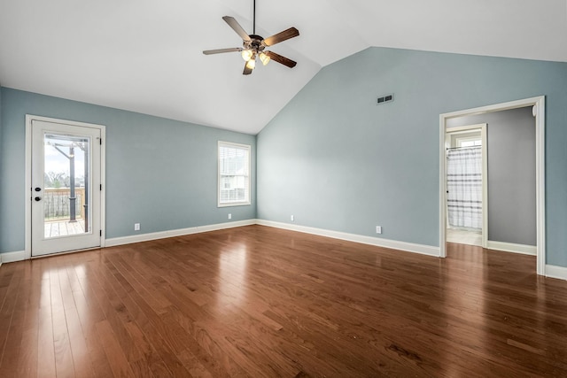 unfurnished living room featuring dark wood-type flooring, ceiling fan, and plenty of natural light