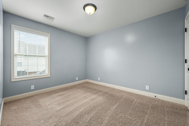 spare room featuring carpet floors