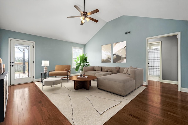 living room featuring wood-type flooring, plenty of natural light, high vaulted ceiling, and ceiling fan