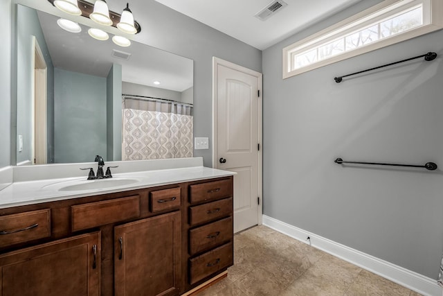 bathroom featuring vanity and a shower with shower curtain