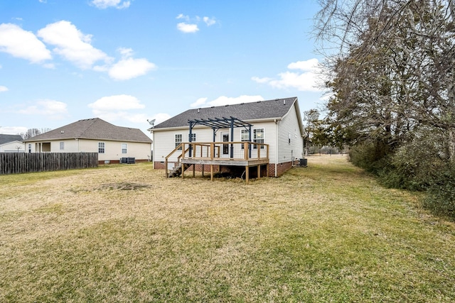 rear view of property with a wooden deck, a lawn, cooling unit, and a pergola