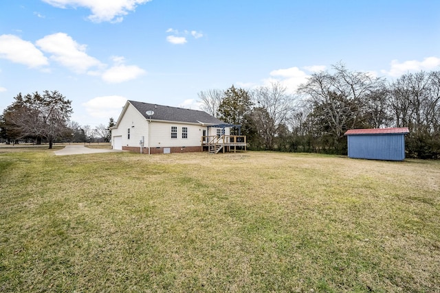 view of yard with a shed and a deck