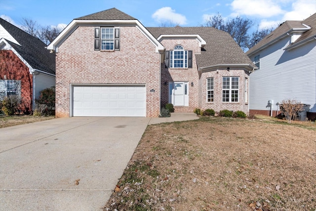 view of front property featuring a garage and a front lawn