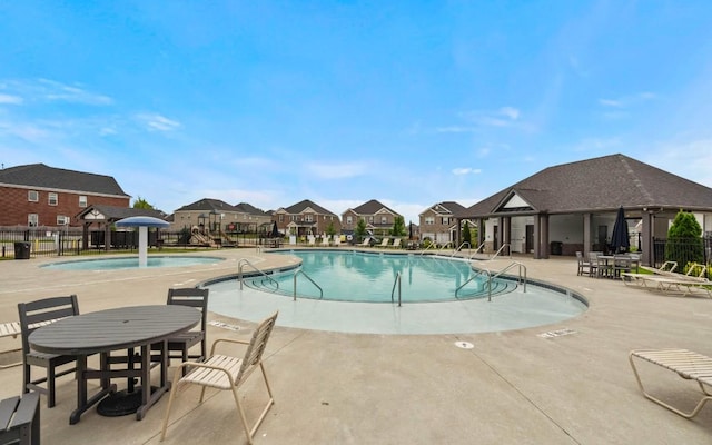 view of swimming pool with a patio area