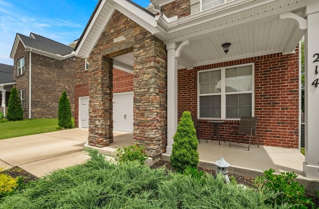 view of exterior entry with covered porch