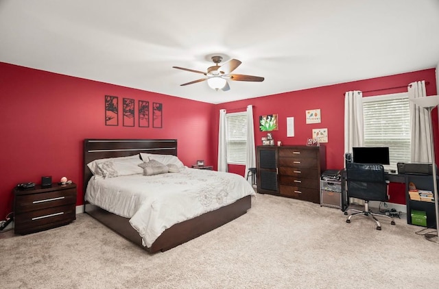 bedroom with light carpet and ceiling fan