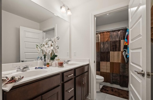 bathroom with a shower with curtain, vanity, toilet, and tile patterned flooring