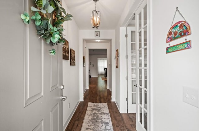 corridor featuring dark hardwood / wood-style floors