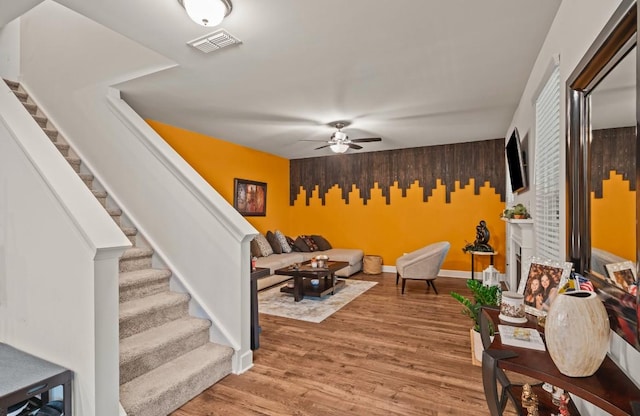 interior space with hardwood / wood-style flooring and ceiling fan