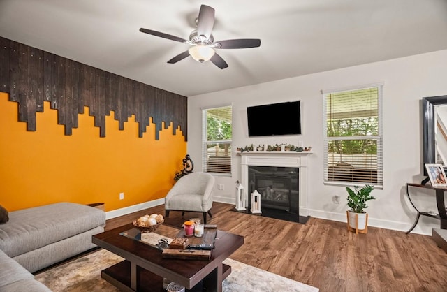 living room with hardwood / wood-style floors and ceiling fan