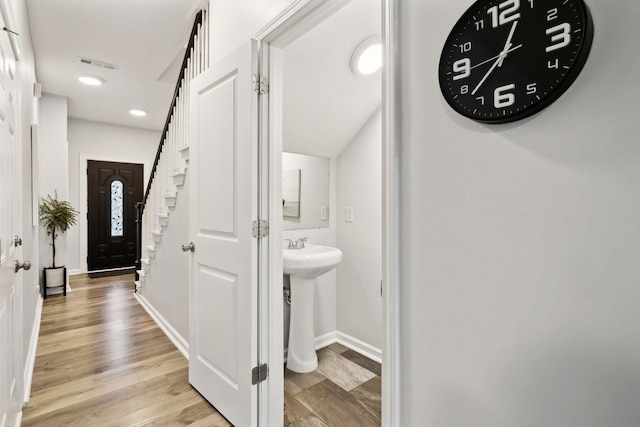 interior space featuring sink and light hardwood / wood-style floors