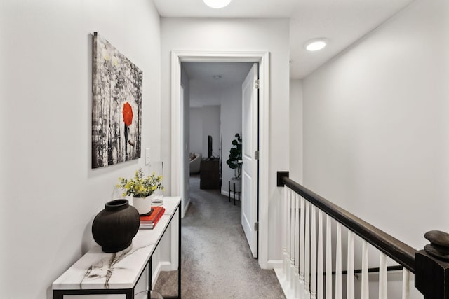 hallway with carpet floors