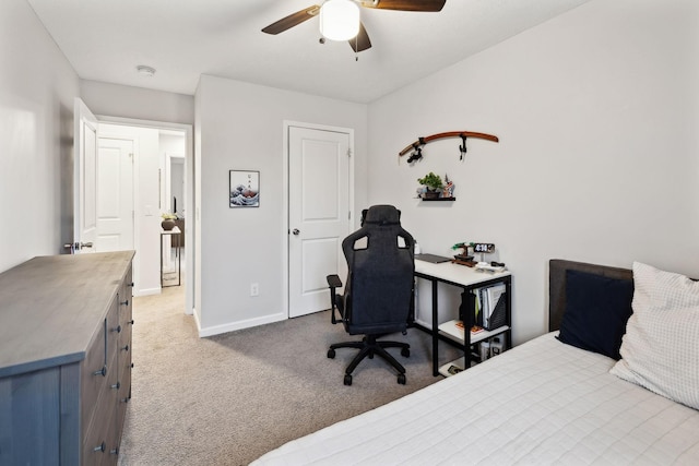 bedroom featuring light colored carpet and ceiling fan