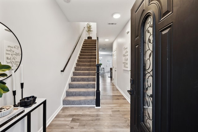 foyer with light hardwood / wood-style floors