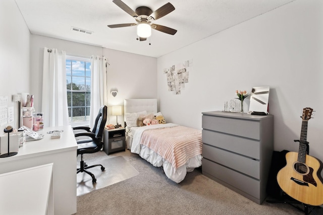 bedroom featuring light carpet and ceiling fan