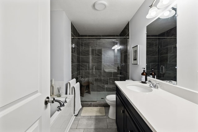 full bathroom featuring vanity, separate shower and tub, tile patterned floors, and toilet