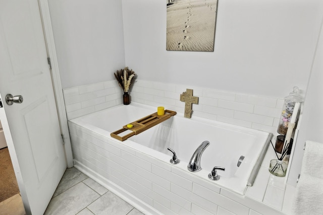 bathroom featuring a relaxing tiled tub and tile patterned floors