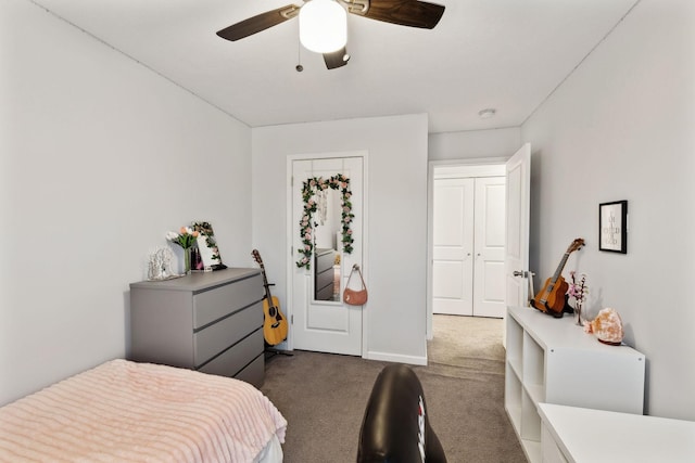 bedroom with ceiling fan and dark carpet