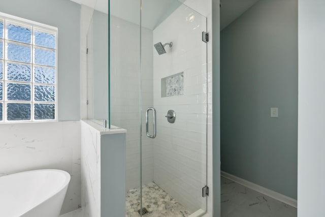 bathroom with separate shower and tub