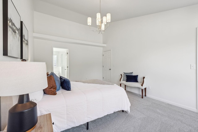 bedroom with a high ceiling, carpet, and a notable chandelier