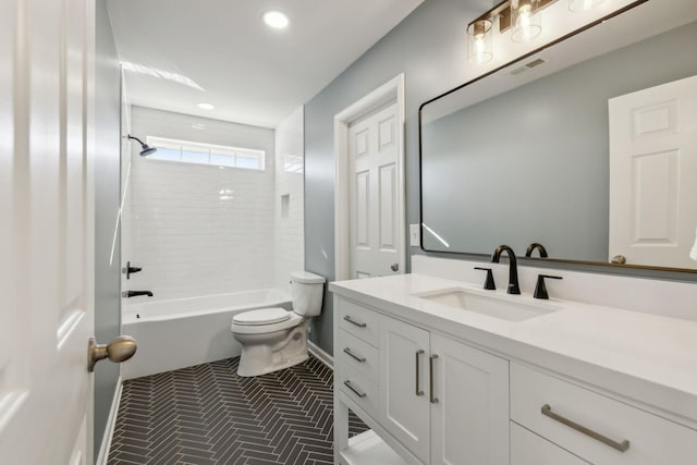 full bathroom with vanity, toilet, and tiled shower / bath combo