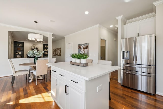 kitchen featuring white cabinetry, a center island, stainless steel fridge with ice dispenser, and pendant lighting