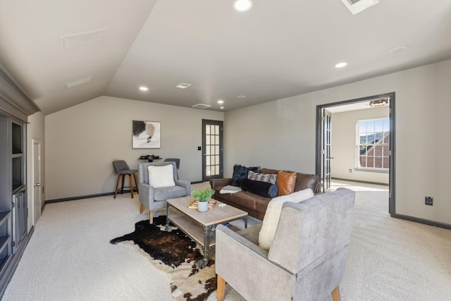 living room with lofted ceiling and light carpet