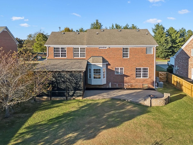 back of house featuring a patio, central air condition unit, and a lawn