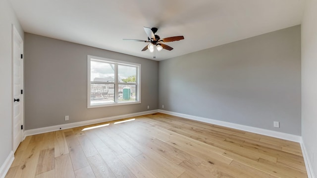 spare room featuring ceiling fan and light wood-type flooring