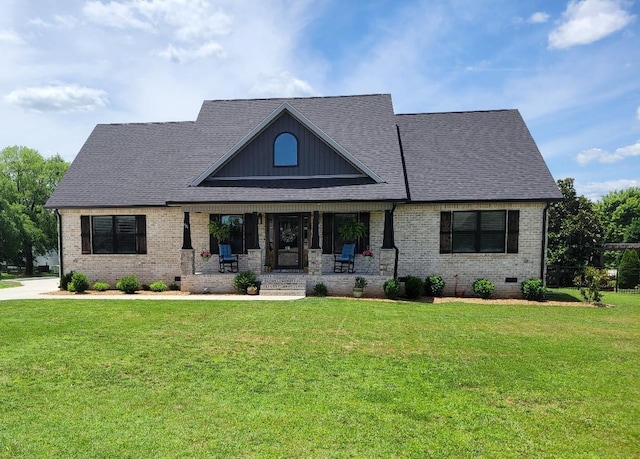 view of front facade with crawl space, a front yard, and brick siding