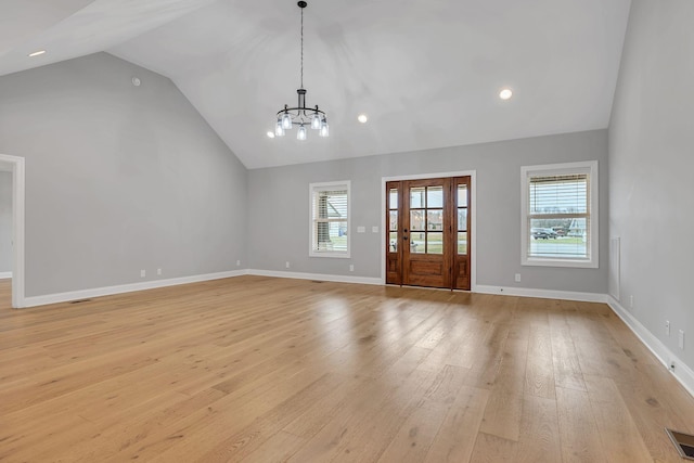 entrance foyer featuring plenty of natural light, light wood-type flooring, visible vents, and baseboards