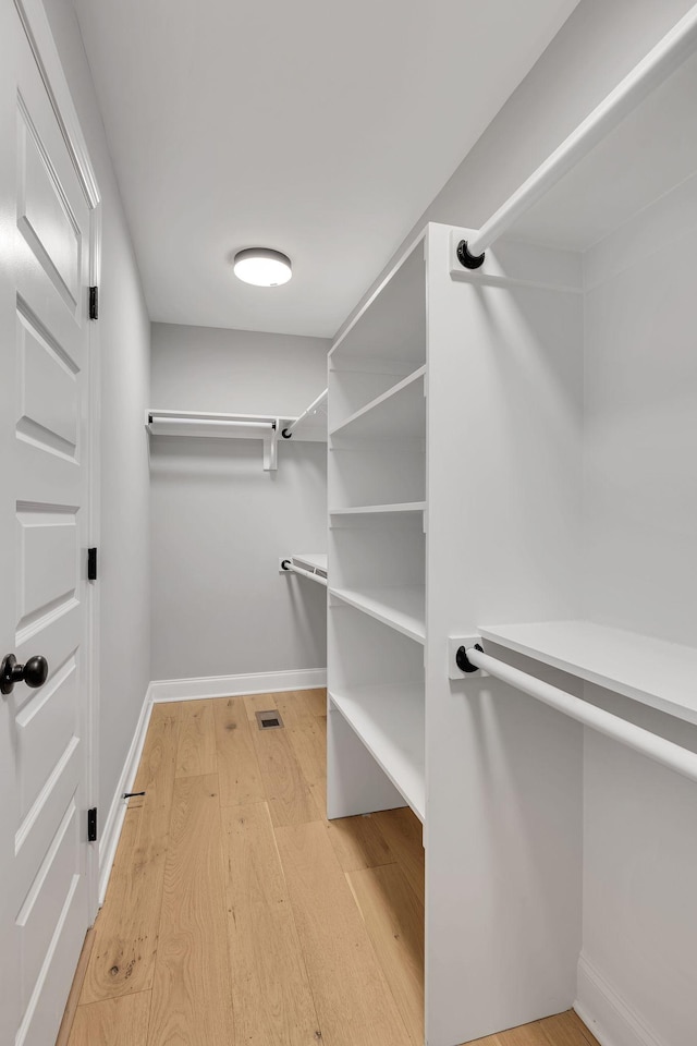 walk in closet featuring light wood-type flooring