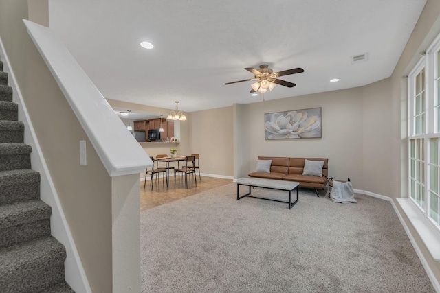 living room with carpet flooring and ceiling fan