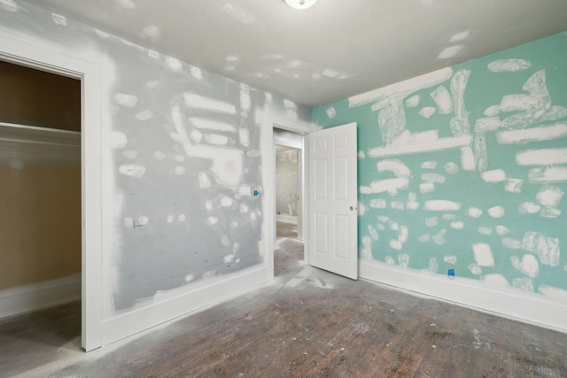 unfurnished bedroom with wood-type flooring