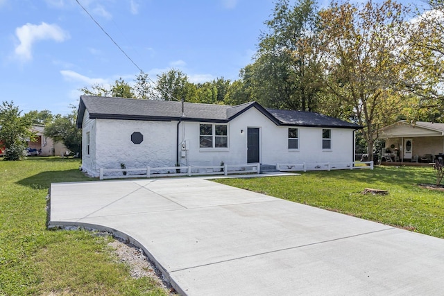 ranch-style house with a front lawn